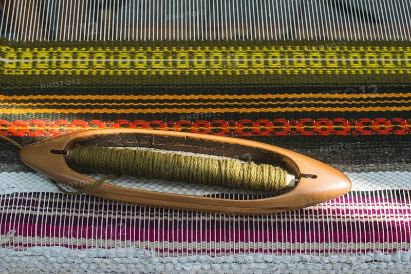 Vintage loom and yarn. Knitting carpet