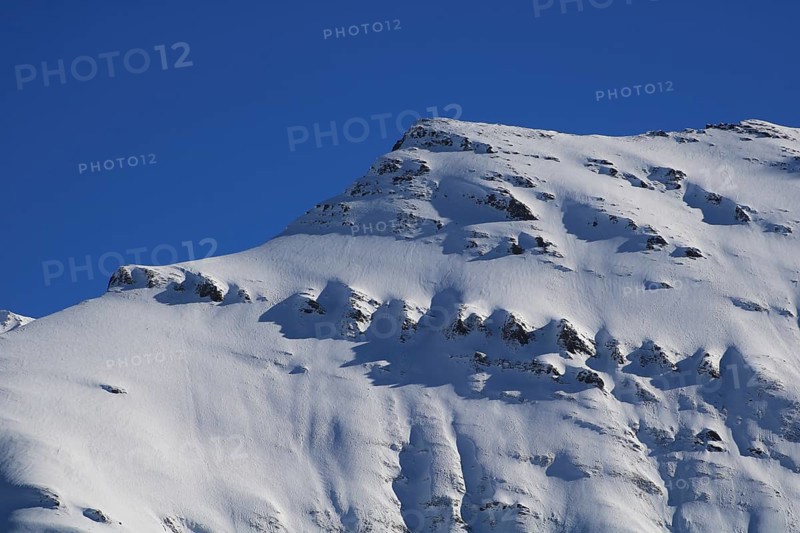 Mittaghorn mountain in winter, Elm