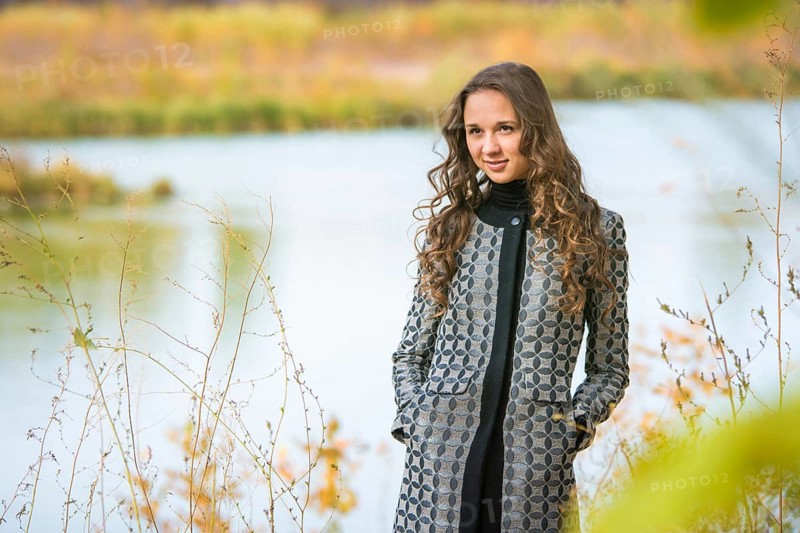 Twenty-five young beautiful girl walks by Europeans autumn forest