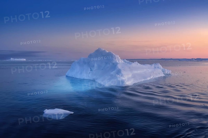 Floating glaciers in the rays of the setting sun at polar night