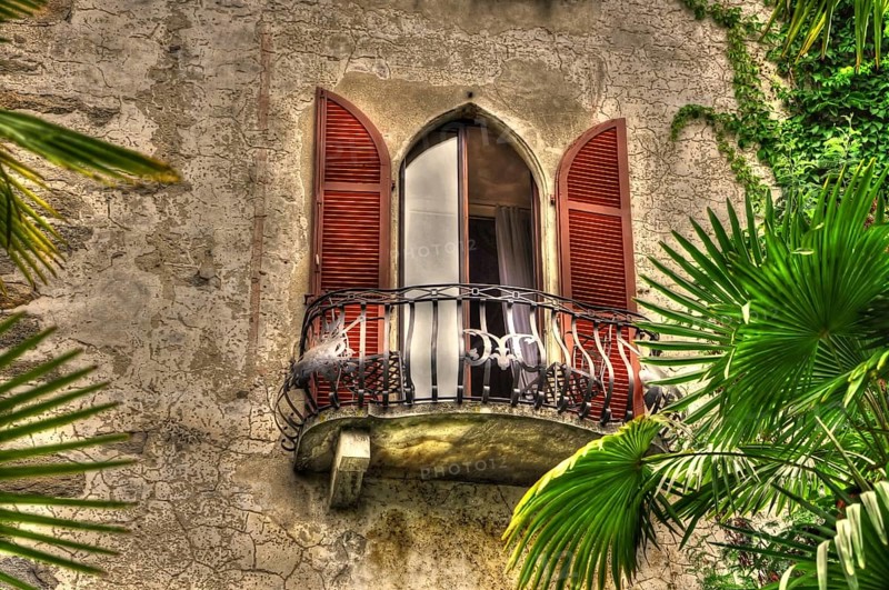 Old House with Balcony with Palm Leaves in Ascona, ticino, Switzerland