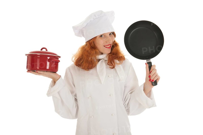 Female cook chef with red hair and pots and pans isolated over white background