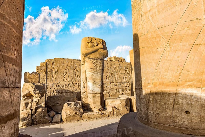 Headless statue among the ruins in Karnak Temple, Luxor