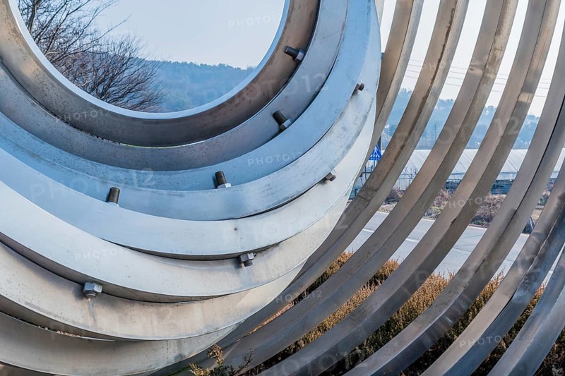 Cheonan, South Korea. January 3, 2020: Closeup sculpture of concentric circles inside one another in public park near entrance to Yu Gwan Sun shrine. Artist unknown