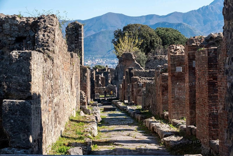 POMPEII, ITALY, MAY 04, 2022, A beautiful typical cobbled street in the ancient city of Pompeii, Southern Italy
