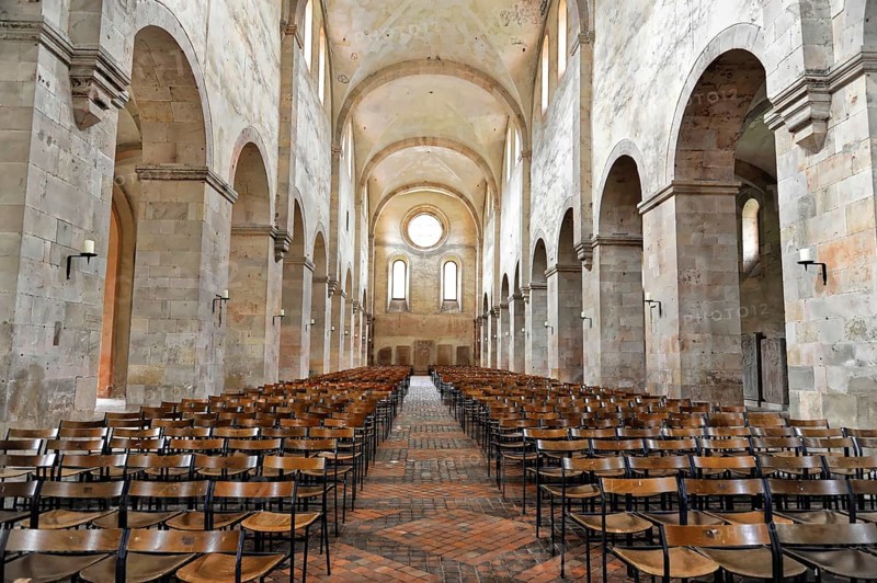 Interior view of the central nave, basilica, monastery church, founded in 1136, Eberbach Monastery, Eltville am Rhein, Rheingau, Hesse, Germany, Elongated nave with rows of wooden chairs and high ceilings, Eltville am Rhein, Rheingau, Hesse, Germany