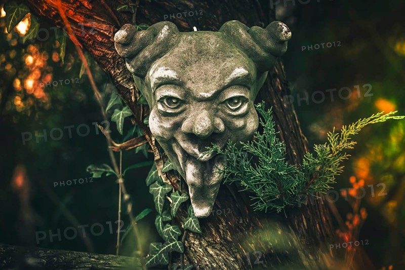 Demon mask in a garden