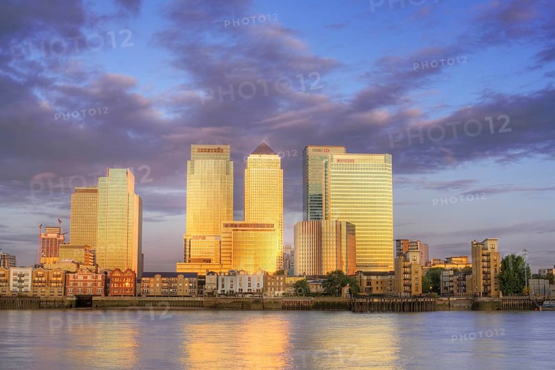 Canary Wharf District at sunrise. Canary Wharf is a commercial estate on the Northern side of the Isle of Dogs and one of the main financial centres of the UK. London England