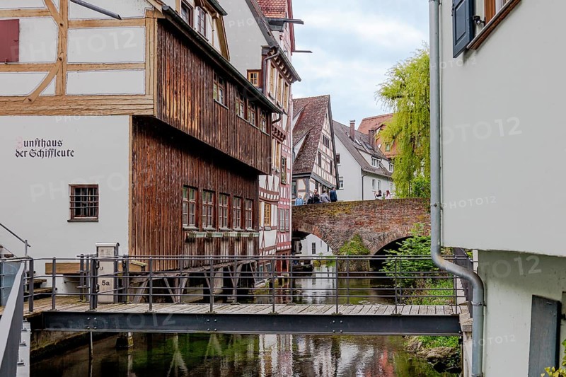 The picturesque and romantic fishermen's quarter in Ulm with the bridges over the little river Blau and the fishermen's guild house, old town view