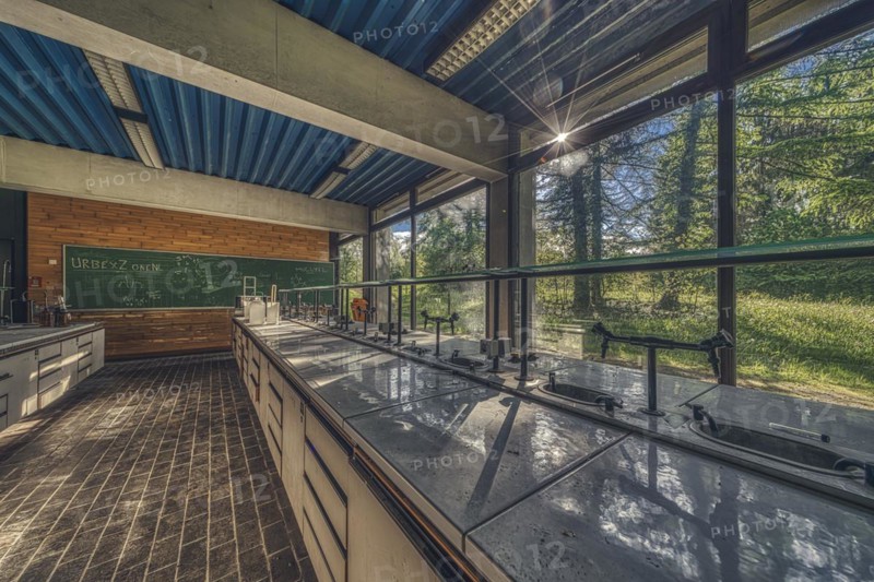 Sunlit, abandoned laboratory with old lab benches and a view of the countryside, Institute of Molecular Biology, Lost Place, Sint-Genesius-Rode, Province of Flemish Brabant, Belgium