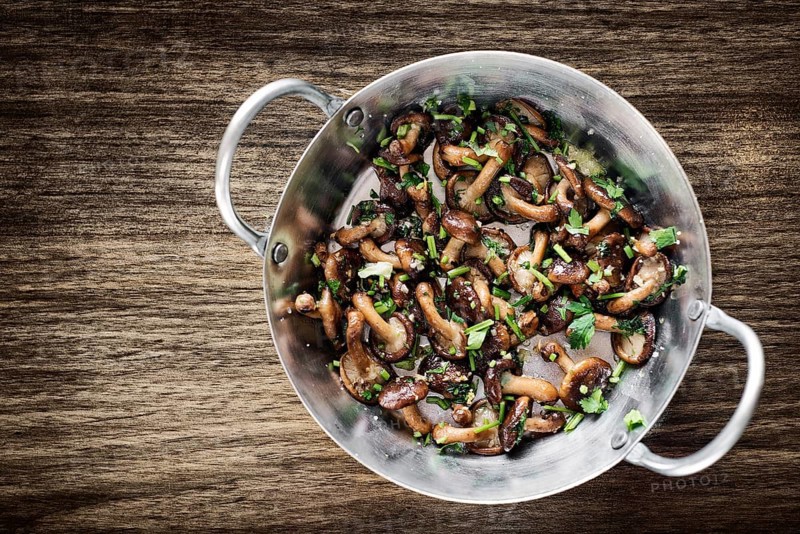 Fried shiitake mushrooms in garlic herb and olive oil tapas snack