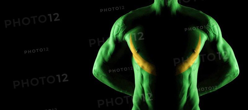 Mauritania flag on muscled male torso with abs, black background