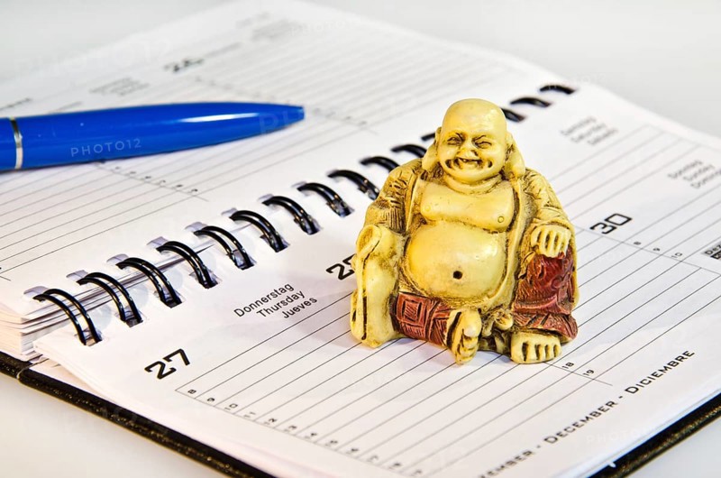 Buddha statute sitting on schedule in the office