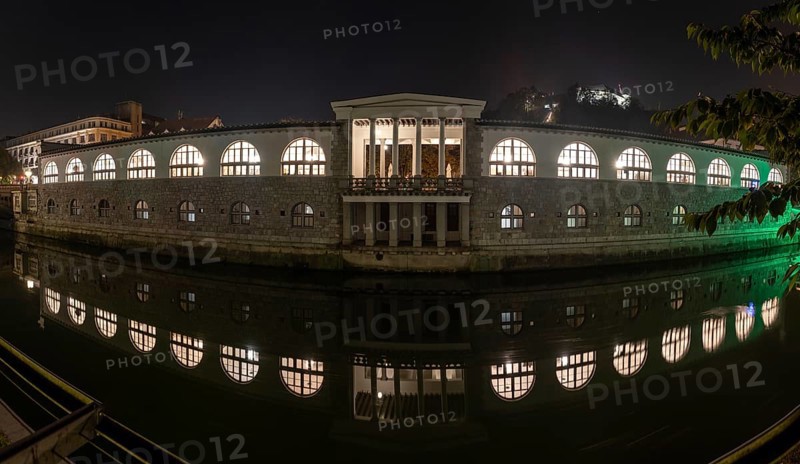 Iconic building of the central market in Ljubljana illuminated at night, Slovenia