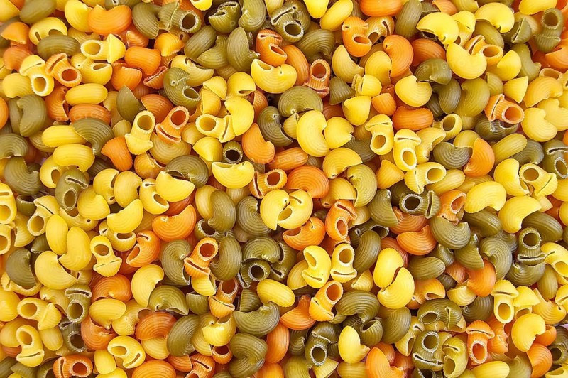 The texture of the yellow, green and orange pasta