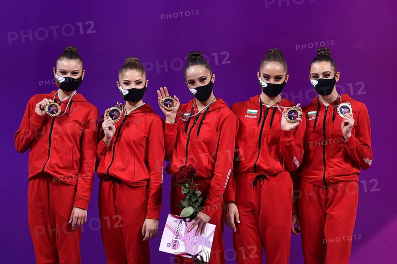 Sofia, Bulgaria - 27 March, 2021: Members of team Bulgaria pose with their gold medals on the podium at Group Apparatus Finals Award Ceremony at the 2021 Rhythmic Gymnastics Sofia World Cup, Sofia, Bulgaria