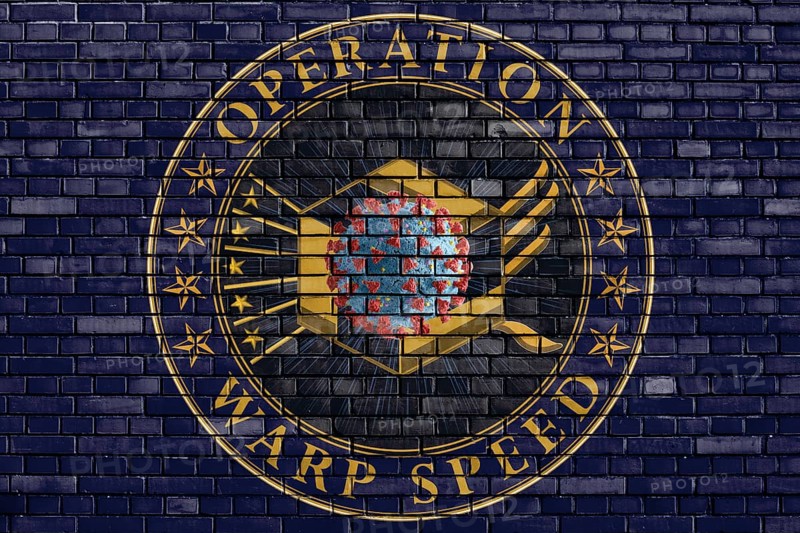 Flag of Operation Warp Speed painted on brick wall