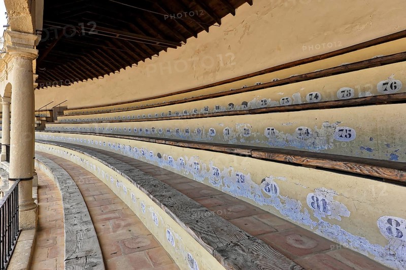 Bullring of Ronda, Plaza de Toros, Numbered rows of seats in an arena with old-style wood and stone construction, Ronda, Province of Malaga, Andalusia, Spain