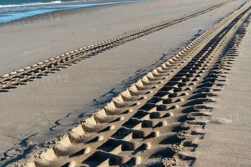 Rough tire tracks on the north sea beach