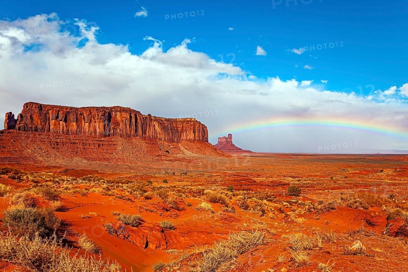 Navajo Indian Reservations. USA. Monument Valley Sentinel Mesa and the bright rainbow. Monument Valley is a unique geological formation in Arizona and Utah