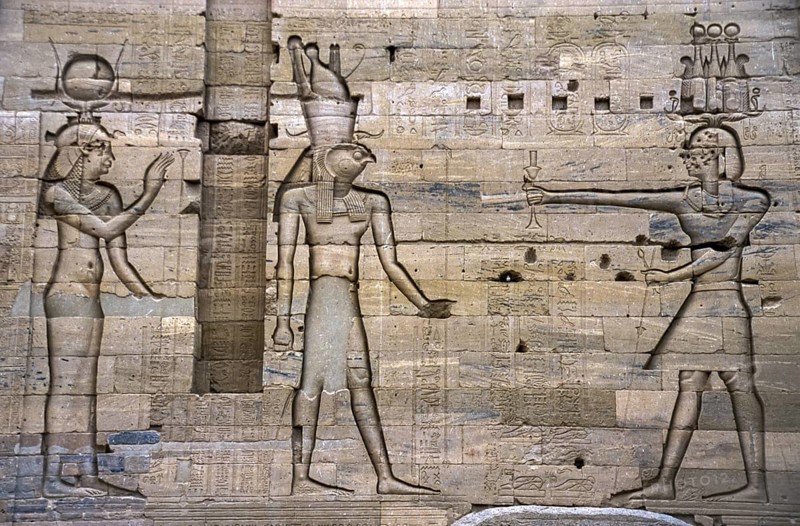 Scanned historical colour photo of relief-like pharaohs and gods carved into a wall in the temple of Karnak, Egypt, Egypt