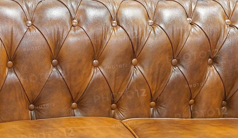 Brown leather sofa backrest upholstery pattern