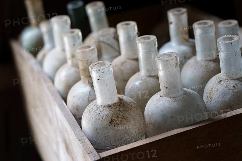 Old empty bottles, essences for alcoholic beverages, old Ripoll winery, Llucmajor, Majorca, Balearic Islands, Spain