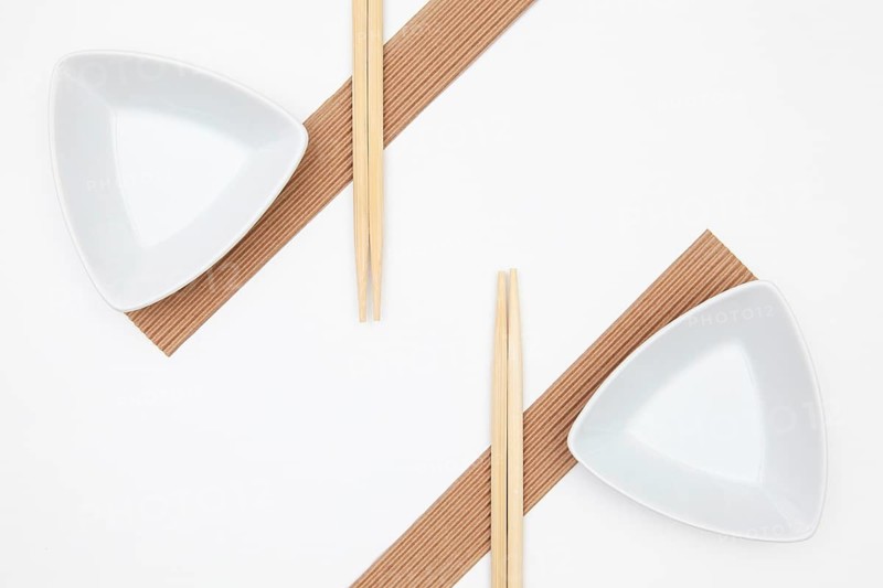 Top View Of White Empty Sushi Plates With Bamboo Chopsticks. Symmetry Food Design