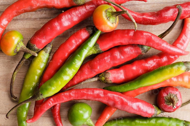 Red hot chilli pepper on milled paprika