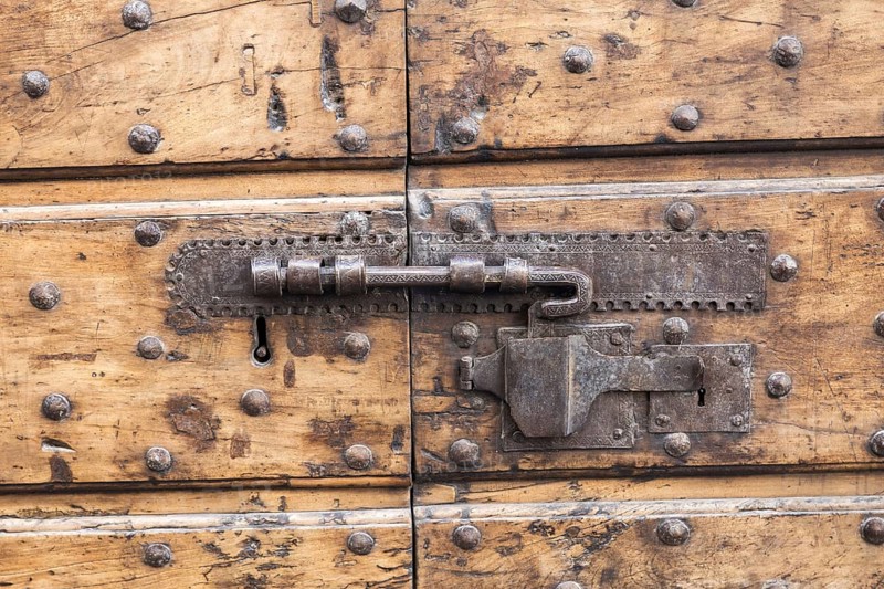 Close up of rustic old door in Spoleto, Italy