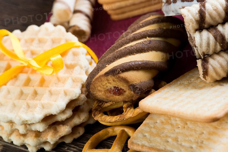 Cookies and biscuits for celebration on wooden table