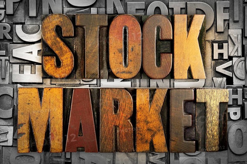 The words STOCK MARKET written in vintage letterpress type