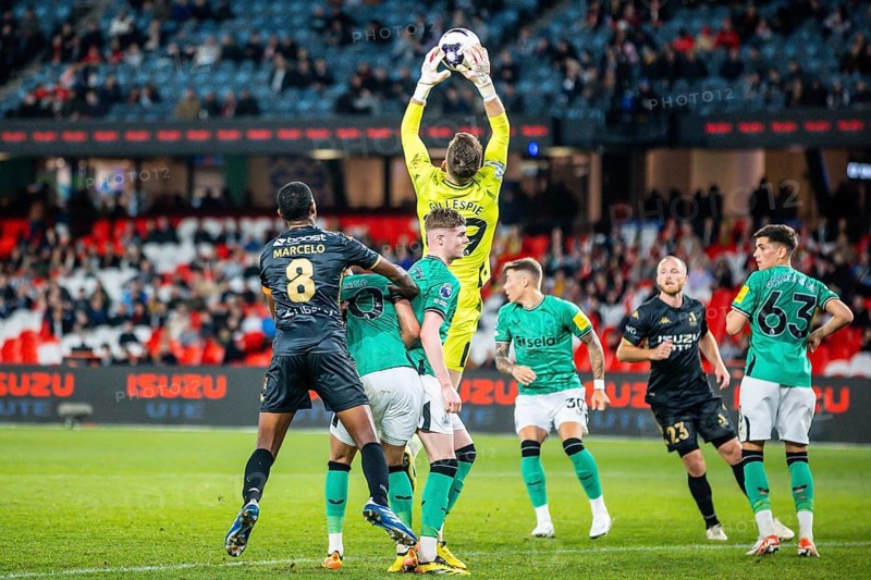 MELBOURNE, AUSTRALIA, MAY 24: Mark Gillespie of Newcastle United saves whilst playing A-League All Stars Men during the Global Football Week at Marvel Stadium on May 24, 2024 in Melbourne, Australia