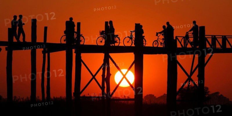 Myanmar, Wooden bridge at Inle Lake at sunset, Inle Lake, Myanmar