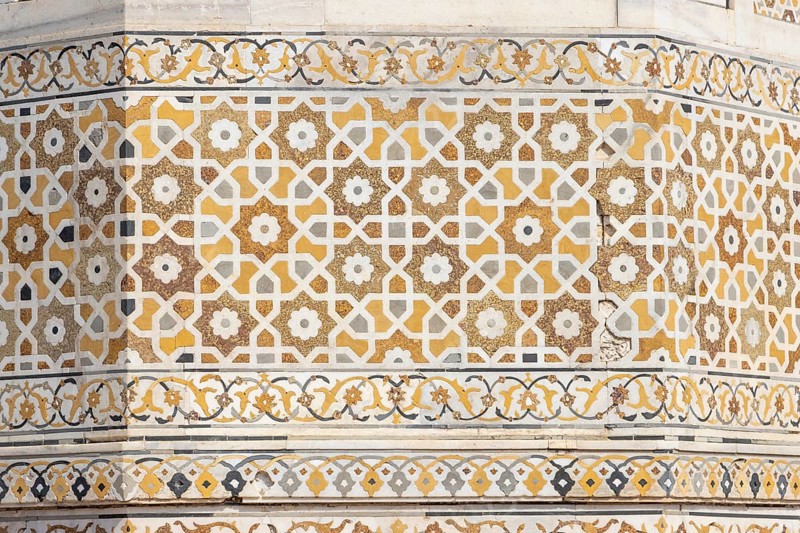 Tomb of I'timad-ud-Daulah, Mirza Ghiyas Beg, a high official in the Mughal Empire. Surrounded by charbag, the Indo-Persian style garden, the white marble mausoleum decorated with pietra dura stone inlay technic is often called Baby Taj or Bachcha Taj. It is a fine example of the Mughal architecture, and was one of the inspirations for the design of the Taj Mahal. Details of the decoration – pietra dura, the stone inlay work. Agra, Uttar Pradesh, India