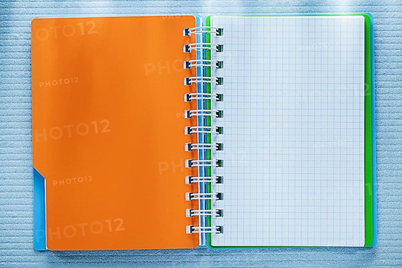 Spiral checked notebook directly above