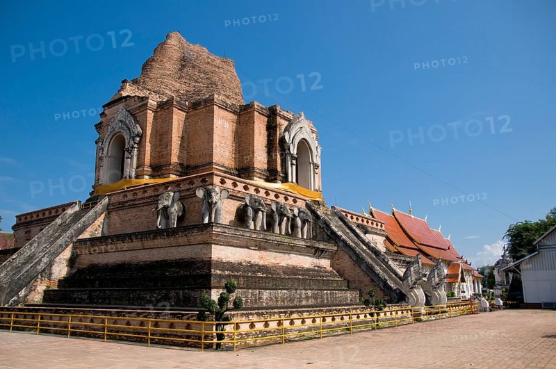 Wat Chedi Luang translates literally from the Thai as ‘Monastery of the Great Stupa'. Construction of the temple began at the end of the 14th century when the Lan Na Kingdom was in its prime. King Saen Muang Ma (1385-1401) intended it as the site of a great reliquary to enshrine the ashes of his father, King Ku Na (1355-85). Today it is the the site of the Lak Muang or City Pillar. The annual Inthakin ceremony occurs within the confines of the temple.<br/><br/> Chiang Mai (meaning 'new city'), sometimes written as 'Chiengmai' or 'Chiangmai', is the largest and most culturally significant city in northern Thailand. King Mengrai founded the city of Chiang Mai in 1296, and it succeeded Chiang Rai as capital of the Lanna kingdom