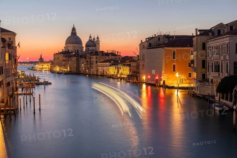 Morning atmosphere in front of sunrise, view of the Grand Canal from the Ponte dell' Accademia, Basilica Maria della Salute in the background, long exposure, Venice, Italy