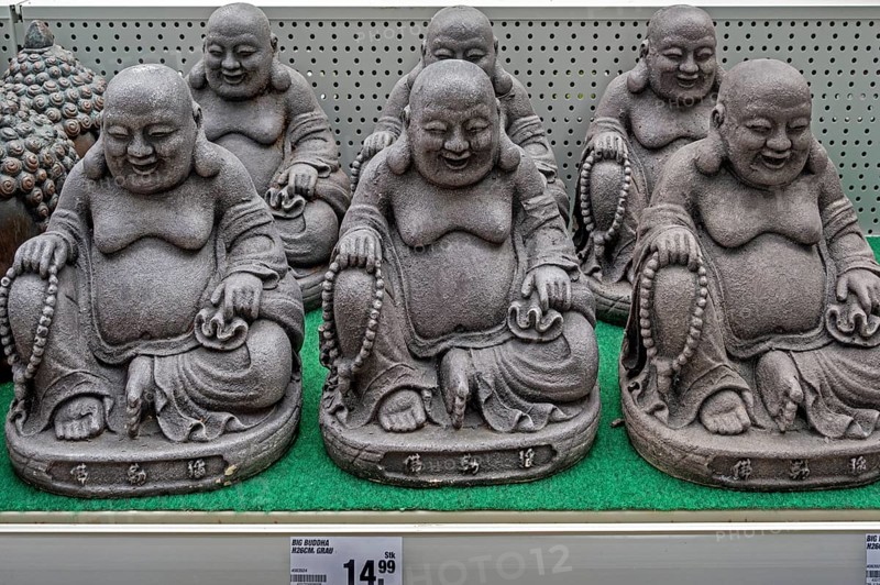Decorative material, Sitting grey Buddha figures in a DIY store, Allgäu, Swabia, Bavaria, Germany