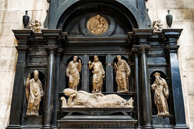 Statue of the lying cardinal in the Duomo. Milan, Italy.