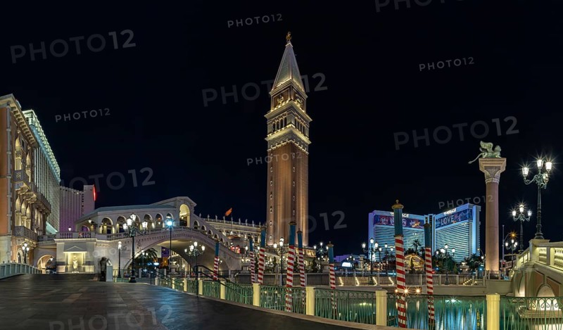 A picture of the Venetian Las Vegas at night, with the Rialto Bridge on the left and the Campanile Tower at the center