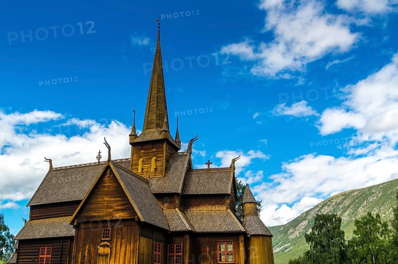 The famouse historic wooden church in Lom in Norway with blue sky summertime