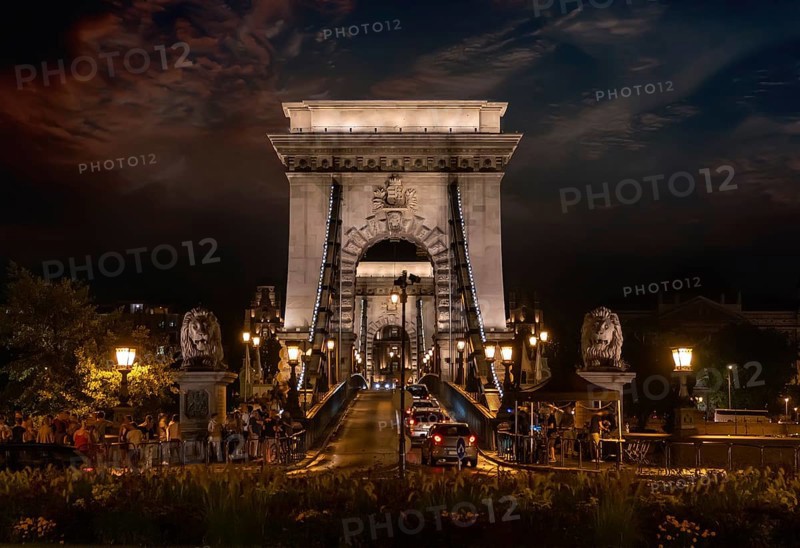 Traffic on Chain Bridge in Budapest at sunset