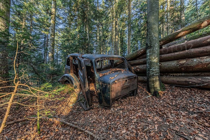 Wrecked car Hudson Terraplane K Tourer Sedan built in 1935 that has been sitting in a forest for decades, Menzingen, Zug, Switzerland