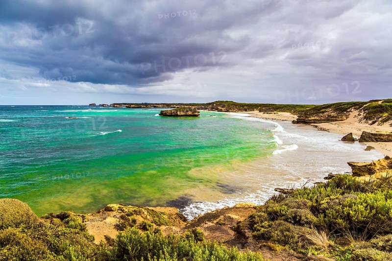 The Great Ocean Road of Australia. Picturesque seashore, coastal cliffs and sandy beaches of the Pacific. The concept of exotic, active and photo-tourism