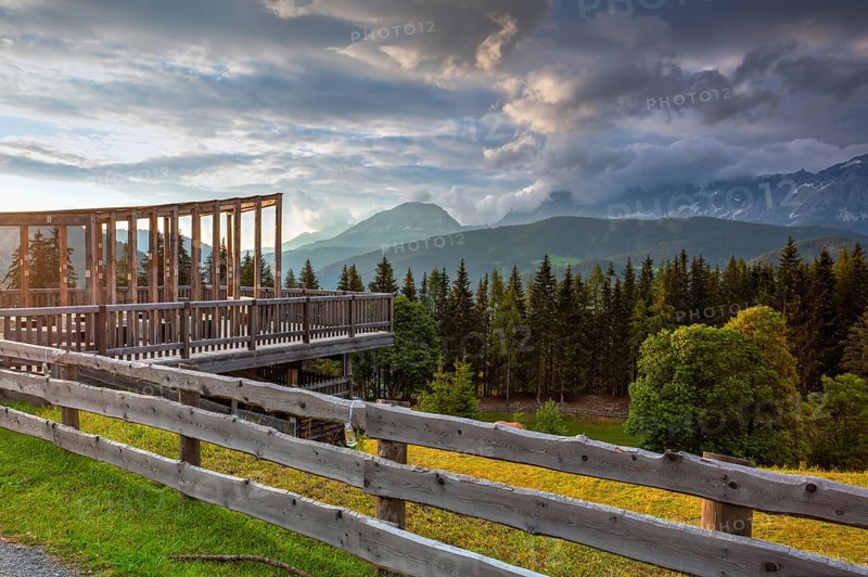 Dachstein mountain and summer valley views from Almwelt Austria resort. Almwelt Austria is located 7 km from the city Schladming. The nicely furnished rooms are set in chalets
