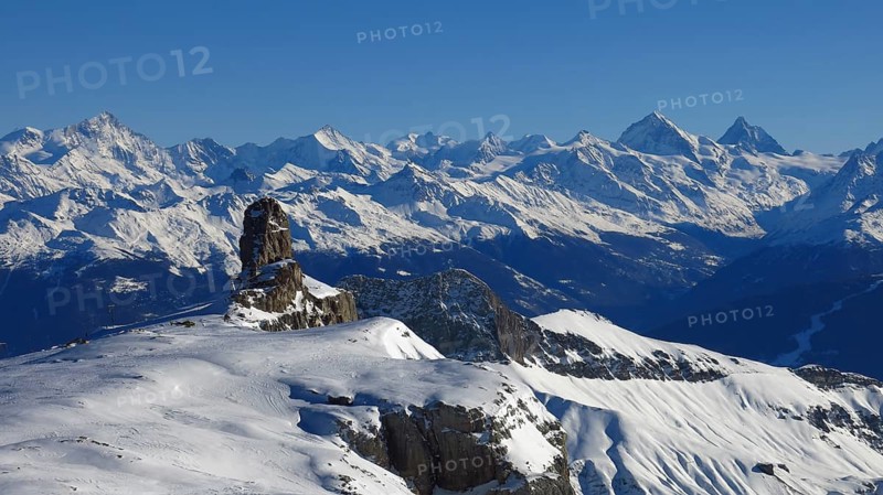 View from the Diablerets glacier, Switzerland. Snow covered mountains in Valais Canton. Winter scene in the Swiss Alps