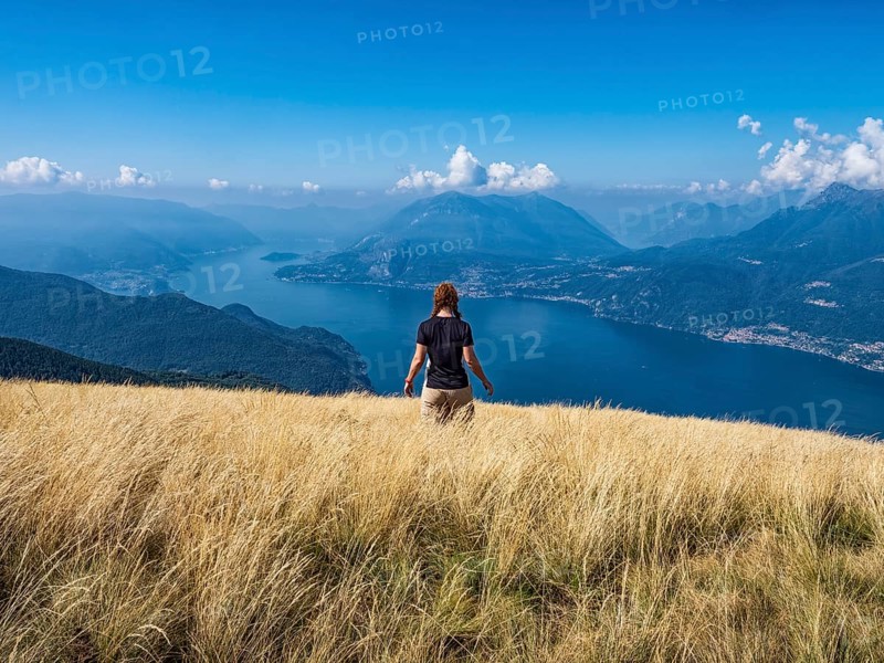 Woman walking in a prairie on Lake Como alps