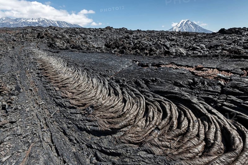 Volcanic landscape of Kamchatka Peninsula: beautiful view of lava field volcanic eruption active Plosky Tolbachik Volcano on a clear, sunny weather. Eurasia, Russian Far East, Kamchatka Region, Klyuchevskaya Group of Volcanoes