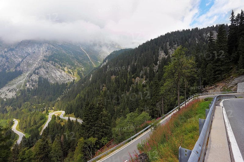Italy, Dolomites. The magnificent mountain valley. Winding and dangerous road - the Serpentine. Photo taken by lens Fisheye